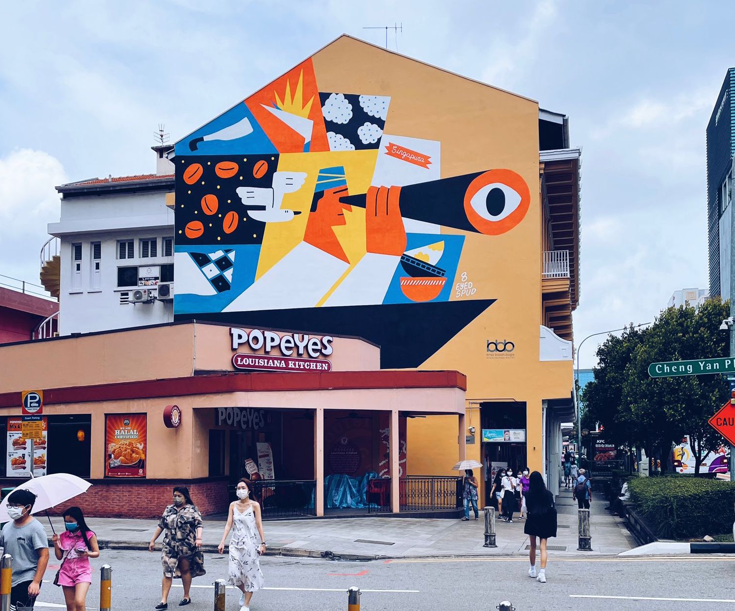 A large public mural commissioned by Bras Basah.Bugis on a precinct shophouse wall